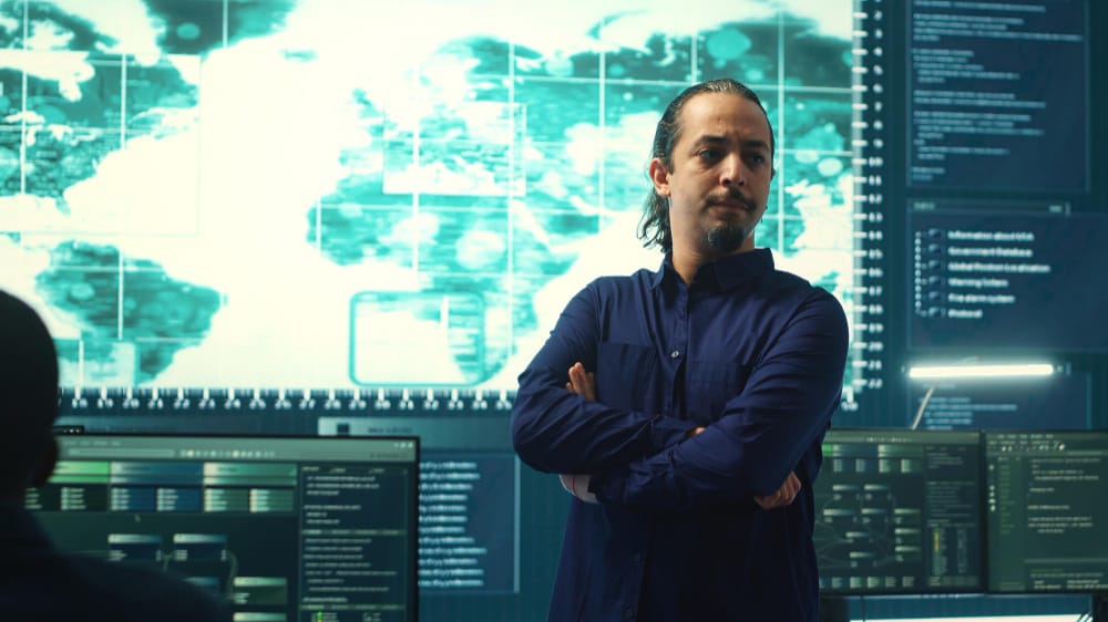 Enterprise DevOps leader reviewing global infrastructure dashboards and deployment metrics, representing Top DevOps as a Service Companies driving automation and scalability in 2026.