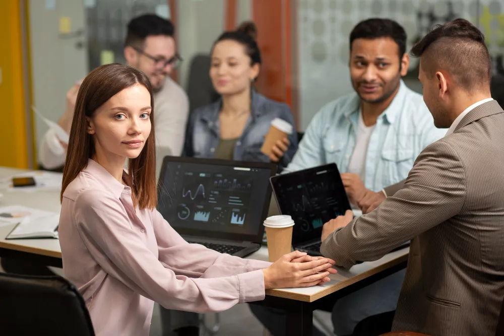 Team discussing devops automation consulting strategies to improve workflow efficiency and software delivery performance