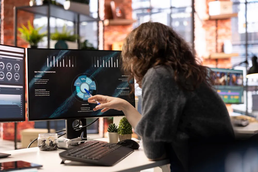 Developer analyzing business analytics dashboard while learning how to Integrate Generative AI into React.js for intelligent data insights.