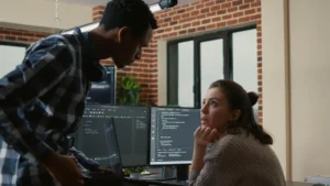 Development team discussing DevOps as a Service for Enterprises vs Startups and evaluating workflows, automation, and scalability requirements